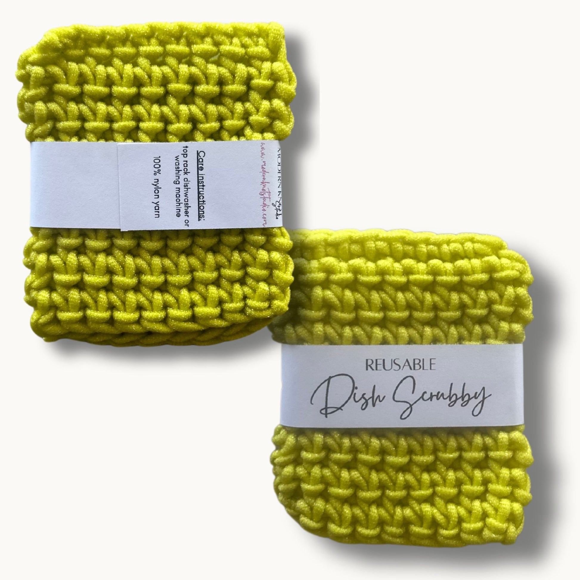 Two lime crochet dish scrubbies with labels, one labeled 'REUSABLE DISH SCRUBBY' and the other with a care instruction label.